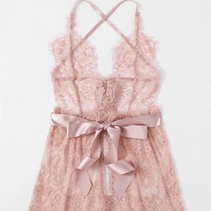 Lace back cross cross body suit